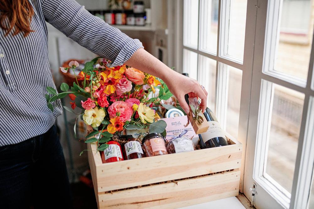 gift basket with wine and flowers